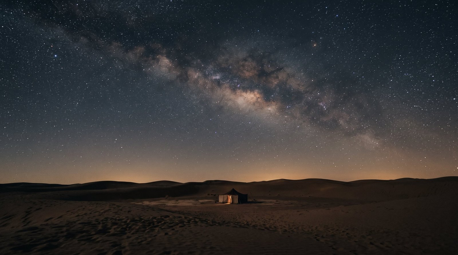 Star-filled night sky over the dunes near Zagora, Morocco